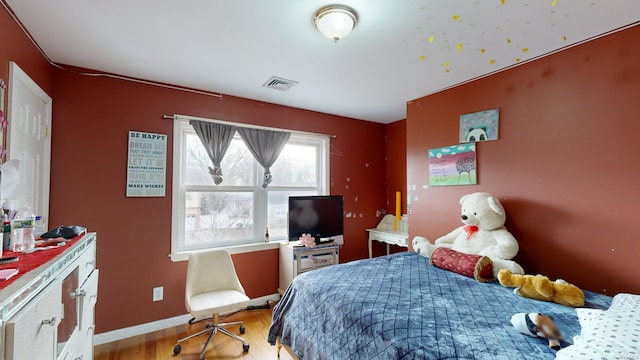 bedroom with light wood-type flooring