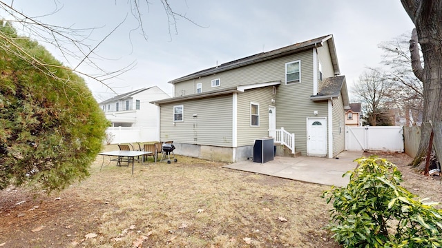 rear view of property featuring a patio