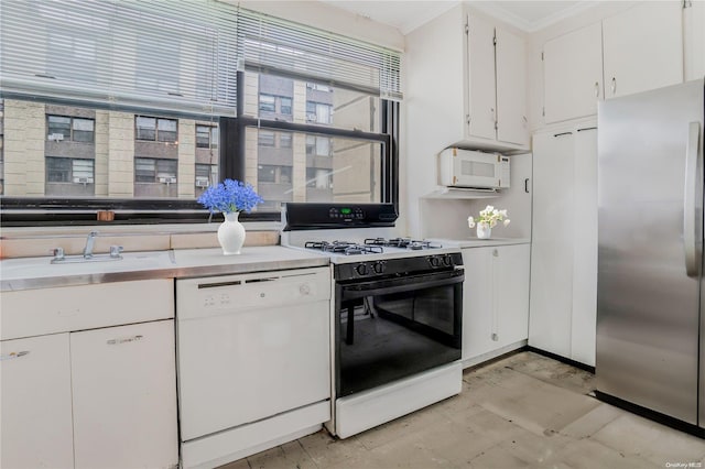 98-22 63rd Dr Unit 5-E, Rego Park, NY 11374 - kitchen featuring white appliances, a sink, white cabinets, and light countertops