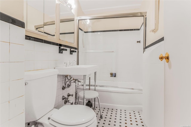 98-22 63rd Dr Unit 5-E, Rego Park, NY 11374 - full bathroom featuring toilet, shower / bath combination, and tile walls