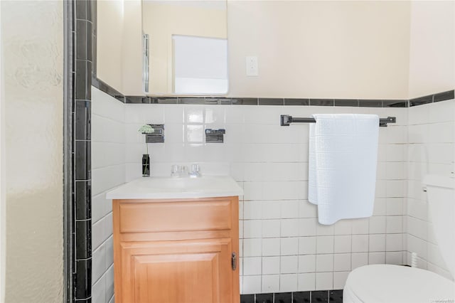 98-22 63rd Dr Unit 5-E, Rego Park, NY 11374 - bathroom featuring tile walls, toilet, and vanity