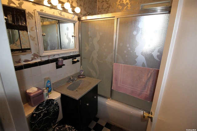 252-51 63rd Ave Unit 5A, Little Neck, NY 11362 - bathroom featuring wallpapered walls, vanity, bath / shower combo with glass door, a wainscoted wall, and toilet