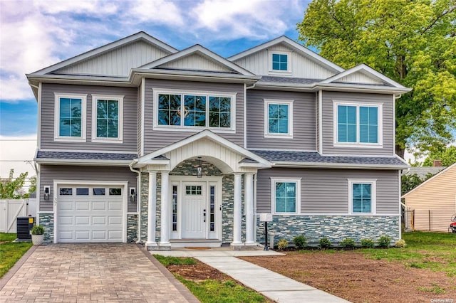 craftsman house with a garage