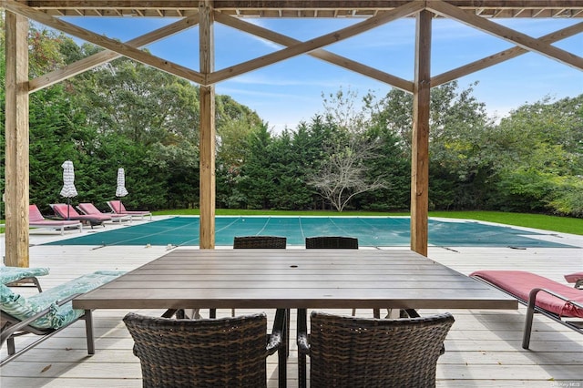 view of swimming pool with a wooden deck