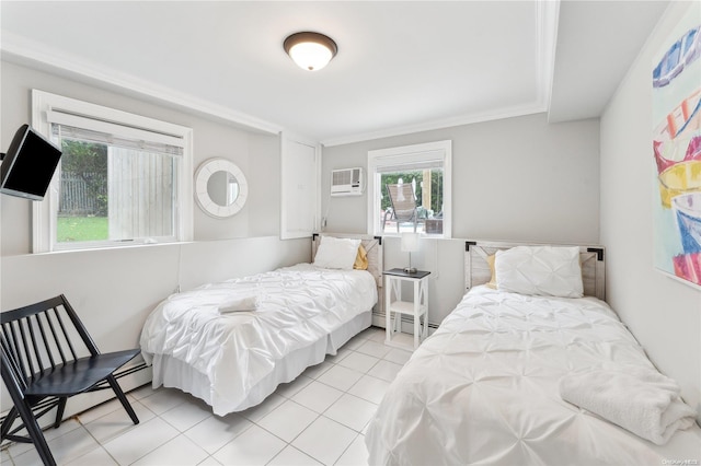 bedroom featuring light tile patterned floors, crown molding, a wall mounted AC, and a baseboard heating unit