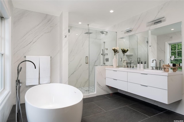 bathroom featuring tile patterned floors, vanity, and separate shower and tub