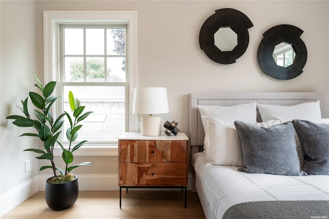 bedroom with hardwood / wood-style floors