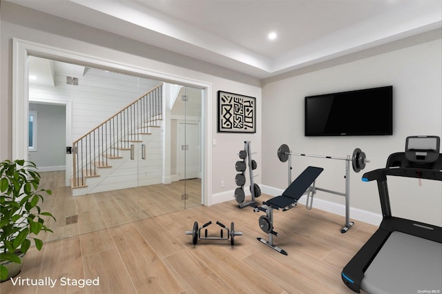 workout room featuring hardwood / wood-style floors