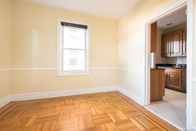 empty room featuring light parquet flooring