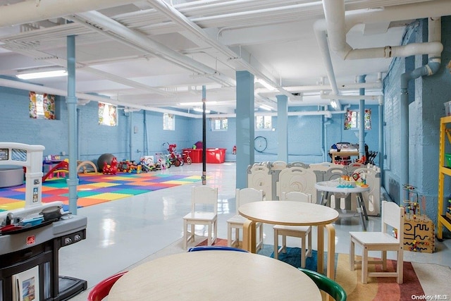 game room featuring concrete flooring