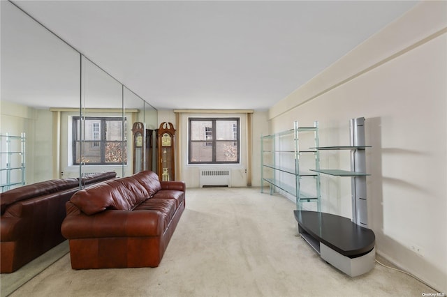 carpeted living room with radiator heating unit