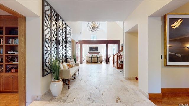 corridor with an inviting chandelier