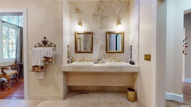 bathroom with hardwood / wood-style floors and vanity