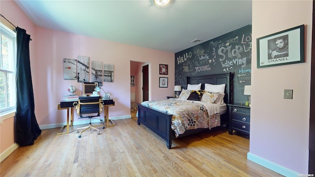 bedroom with light hardwood / wood-style flooring