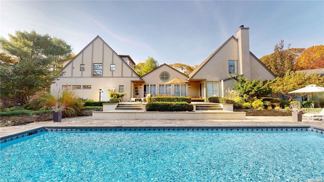 rear view of house with a patio