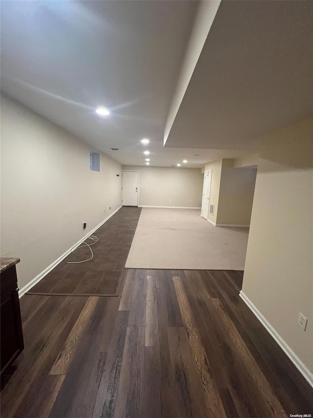 basement with dark wood-type flooring