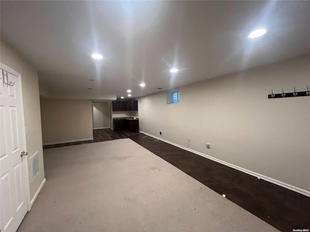 basement with dark wood-type flooring