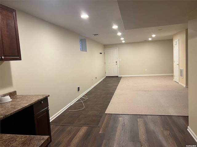 basement with dark wood-type flooring