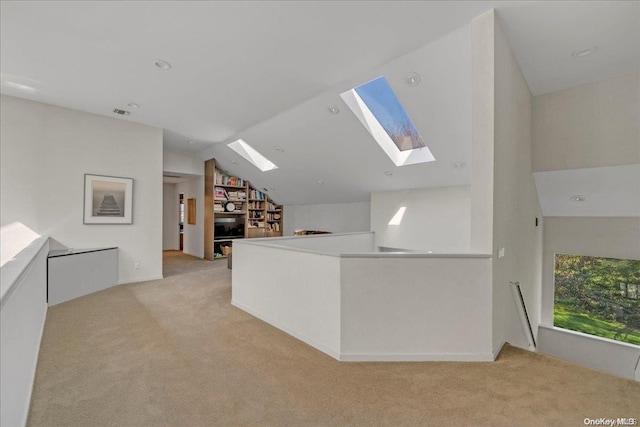 bonus room featuring light carpet and lofted ceiling