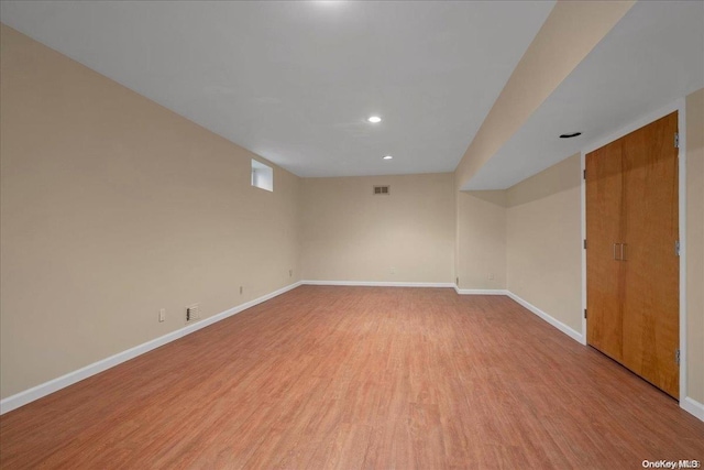 unfurnished room with light hardwood / wood-style floors