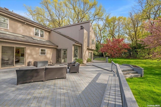 deck featuring a lawn and an outdoor hangout area