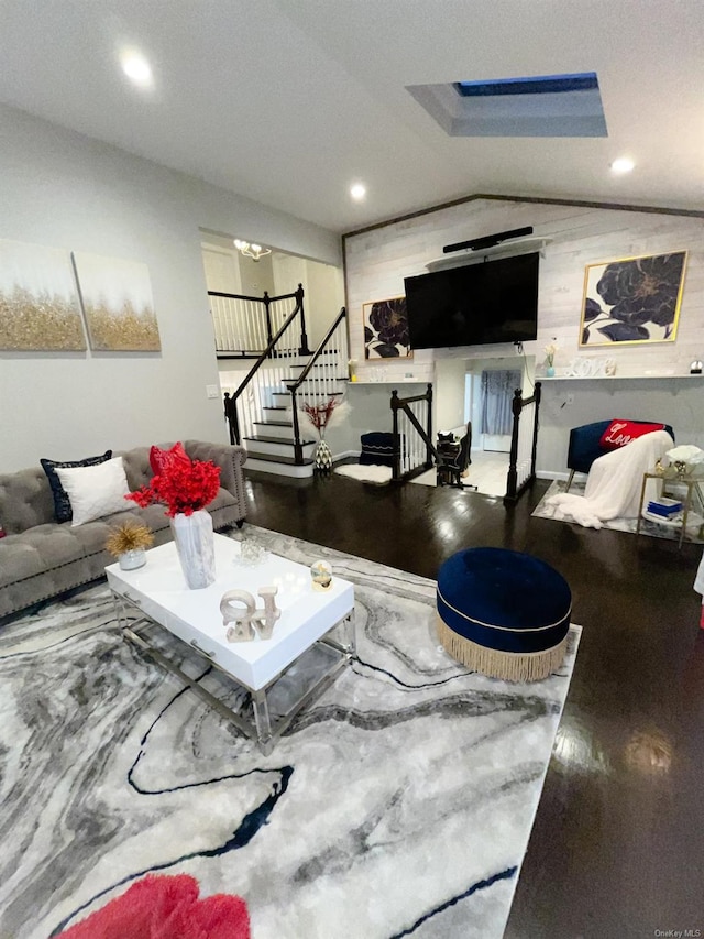 living room featuring wood-type flooring and lofted ceiling