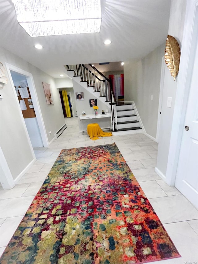 interior space with tile patterned flooring and a baseboard radiator