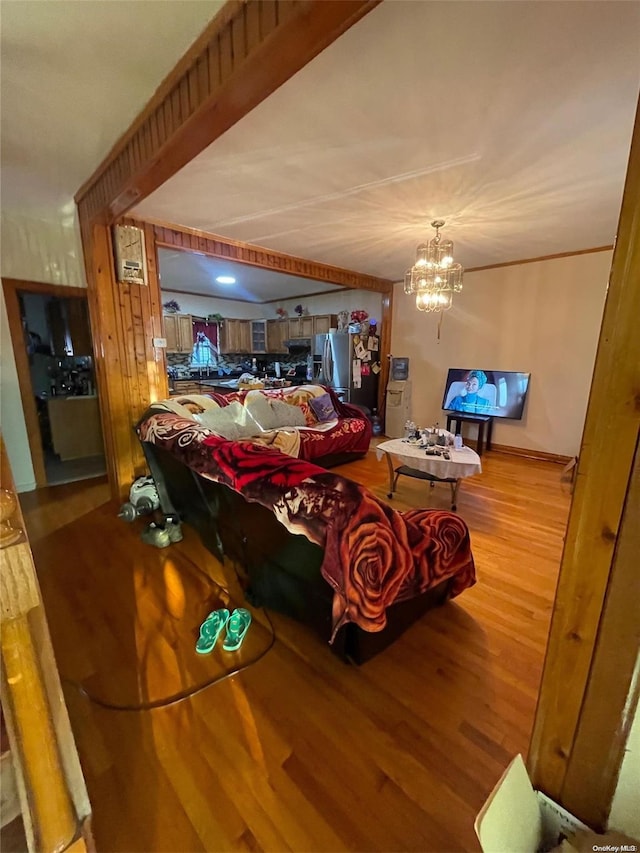 living room featuring hardwood / wood-style flooring and a notable chandelier