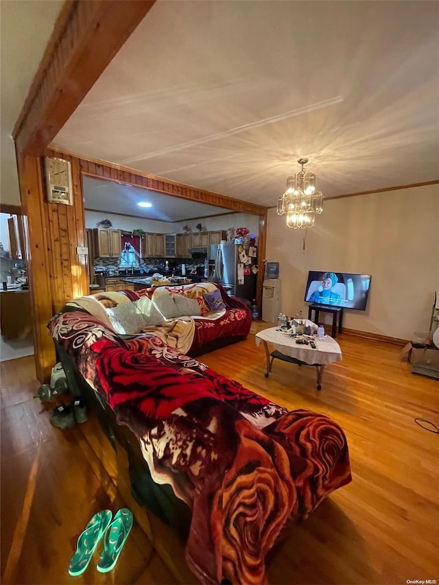 living room with a chandelier and hardwood / wood-style floors