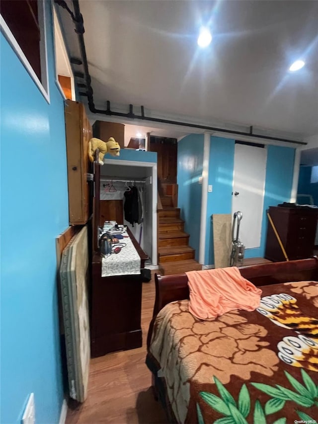 bedroom featuring a closet and hardwood / wood-style flooring