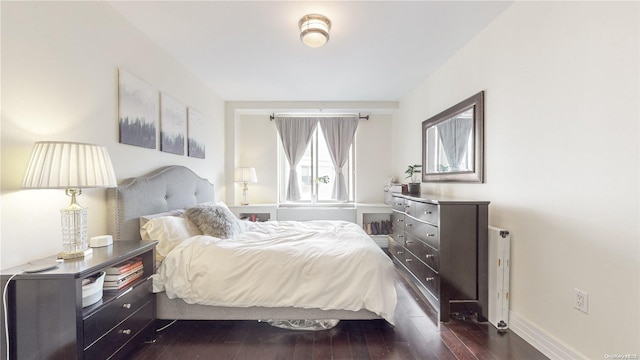 bedroom featuring dark hardwood / wood-style flooring