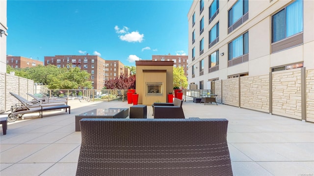 view of patio / terrace with an outdoor fireplace