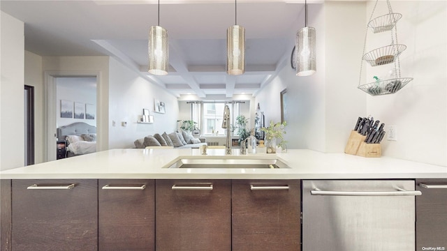 kitchen with pendant lighting, dishwasher, sink, dark brown cabinets, and beam ceiling