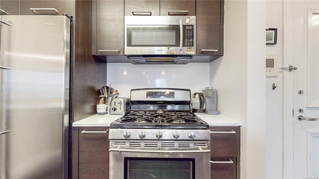 kitchen with dark brown cabinetry and stainless steel appliances