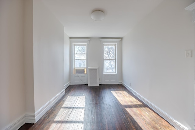 spare room with dark hardwood / wood-style flooring