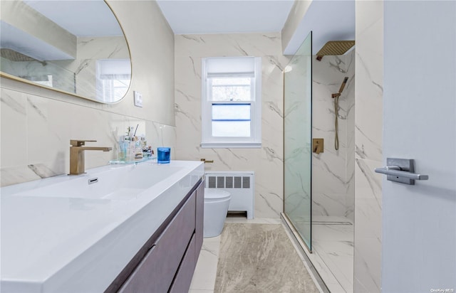 bathroom with vanity, toilet, radiator heating unit, and a tile shower