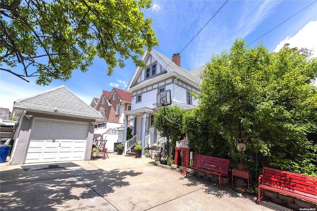 victorian home featuring a garage