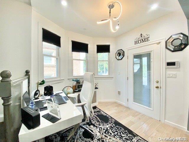 office with light hardwood / wood-style floors