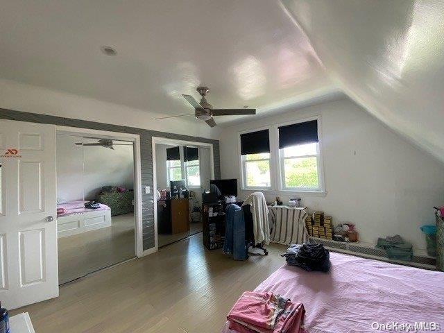 bonus room featuring ceiling fan, lofted ceiling, and light hardwood / wood-style flooring