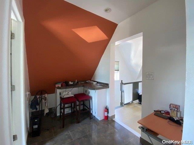 bonus room with vaulted ceiling