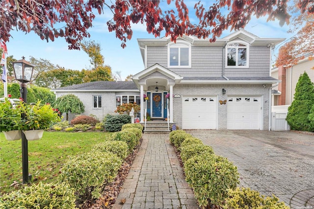 view of front facade featuring a front yard and a garage