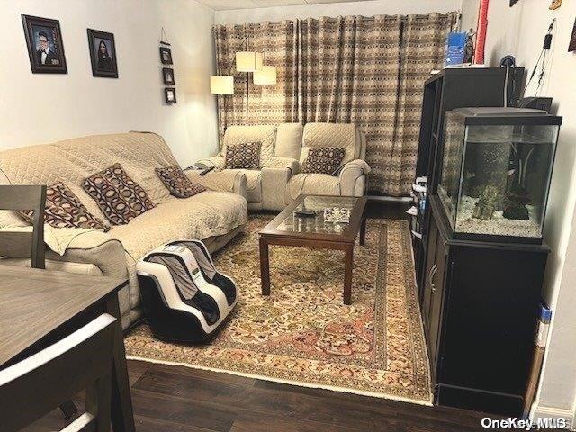 living room with dark wood-type flooring