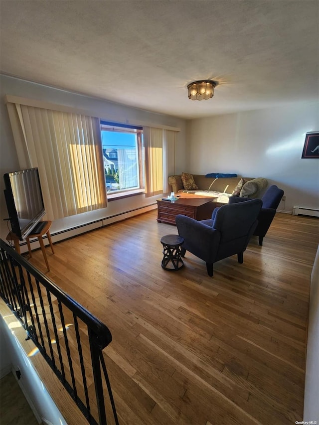 living room featuring hardwood / wood-style flooring and a baseboard radiator