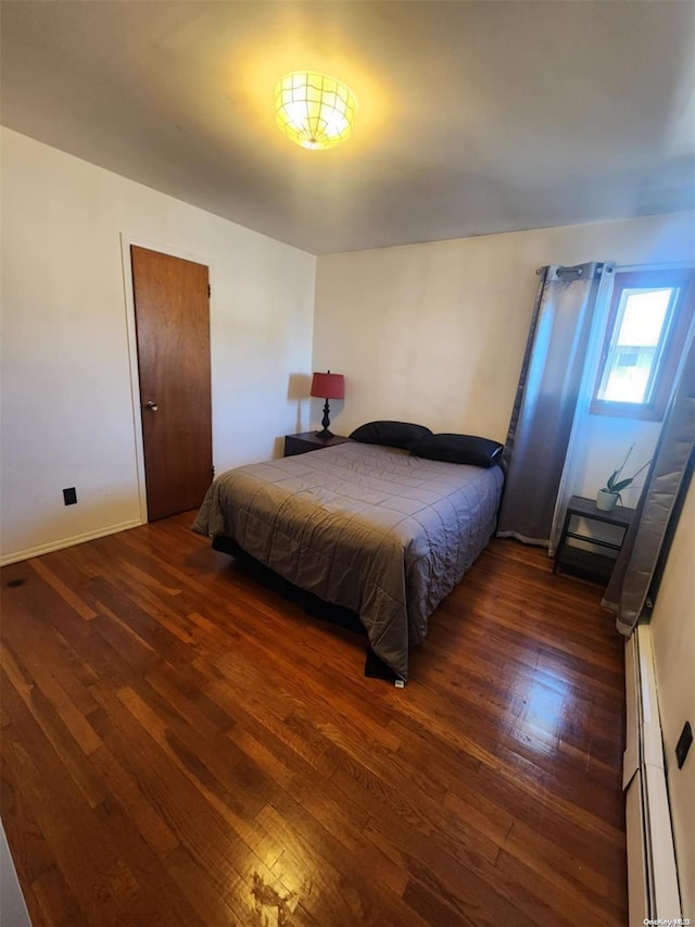 bedroom featuring dark hardwood / wood-style floors