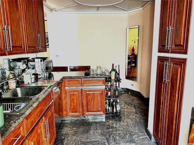 kitchen featuring dishwasher, sink, and dark stone counters