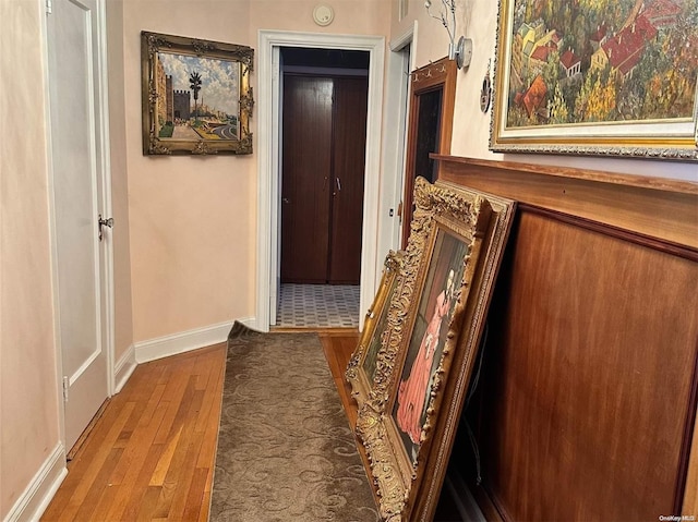 corridor featuring wood-type flooring