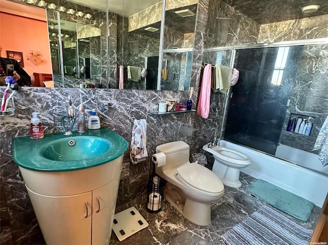 full bathroom featuring toilet, bath / shower combo with glass door, tile walls, and a bidet