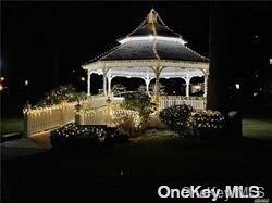 yard at night featuring a gazebo