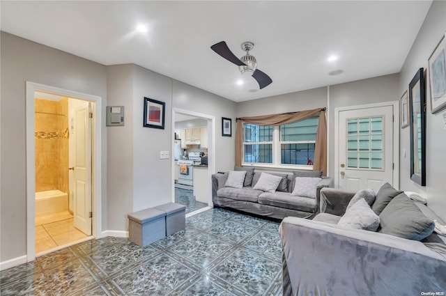 living room featuring ceiling fan and tile patterned flooring