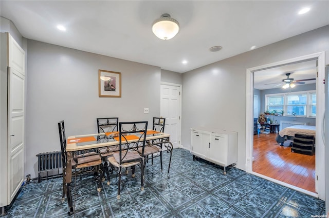 dining space featuring dark hardwood / wood-style floors and ceiling fan